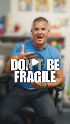 a man sitting in a chair with the words don't be fragile