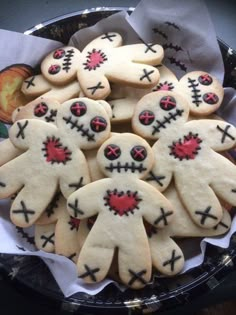 decorated cookies in the shape of zombies on a plate