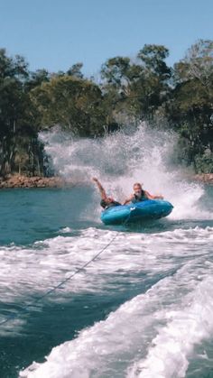 a person on a blue boat in the water