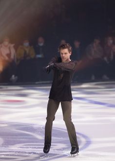 a man is skating on an ice rink