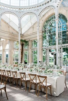 an indoor wedding venue with tables and chairs