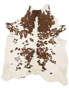 a cowhide rug with brown and white spots