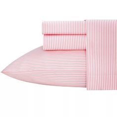 the pink and white striped sheets are folded on top of each other, with two pillows