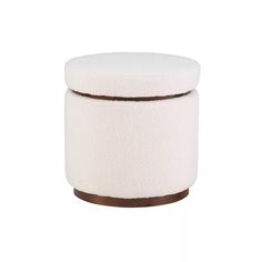 a white stool with brown trim on the top