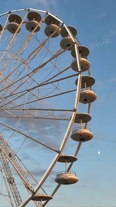 a large ferris wheel sitting on top of a field