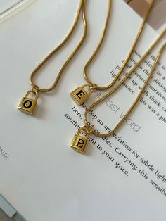 The Lock Initial Necklace is the perfect accessory for personalization and style. Crafted with a letter lock initial charm on sleek snake chain in 20" for styling long layers. Available in letters A - Z Chain Length: 20" Styling Long Layers, Long Layers, Letter Necklace, Initial Charm, A Letter, Snake Chain, Stainless Steel Chain, Initial Necklace, Chain Lengths