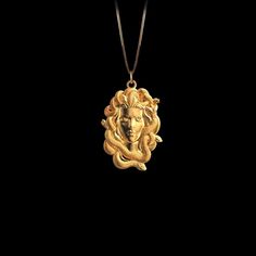 Unleash your inner strength with our Gorgon pendant. This striking piece captures the fierce power and mystique of the legendary Medusa gorgon, symbolizing protection and transformation. A bold statement of resilience, it serves as a reminder of your own untamed spirit and inner power. PENDANT INFORMATIONThis pendant is made of real, solid gold.• Made in USA• Material: 14k or 18k solid gold• Finish: polished• Height: 1.24" (31,5 mm) x Width: 0.82" (21 mm)• Pendant weight: approx. 8 grams (14k)• Medusa Jewelry, Bold Gold Jewelry, Medusa Pendant, Medusa Gorgon, Inner Power, Solid Gold Chains, Box Making, Mini Pendants, Yellow Gold Chain