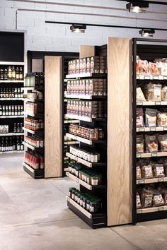 an empty grocery store with shelves full of food