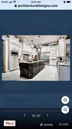 an image of a kitchen with white cabinets and black island in the center, on a blue background