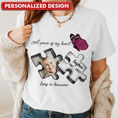 a woman wearing a t - shirt with puzzle pieces on it