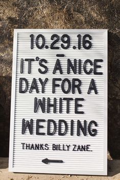 a sign that says it's nice day for a white wedding