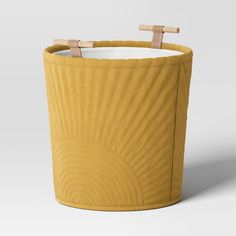 a large yellow basket with two wooden handles