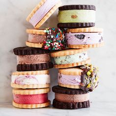 a stack of ice cream sandwiches with sprinkles and cookies on each one