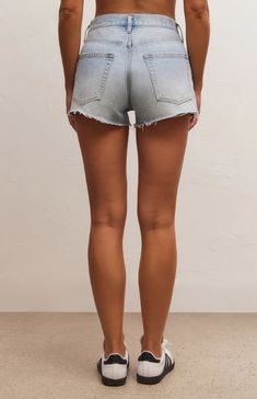 The Classic Hi-Rise Denim Short is cute and so comfortable, you'll reach for day after day. Pair with a fun graphic top or tank and you're good to go. Regular fit Denim: 100% Cotton High rise denim short Raw hem detail 5 pocket Non-stretch denim Machine Wash Cold, Tumble Dry Low Summer Shorts With Frayed Hem And Relaxed Fit, Soft-washed Casual Spring Bottoms, Spring Casual Soft-washed Bottoms, Relaxed Summer Jeans For Everyday, Relaxed Light Wash Summer Jeans, Casual Mid-rise Faded Bottoms, Casual Frayed Hem Shorts, Casual Shorts With Frayed Hem, Jeans With Built-in Shorts For Summer