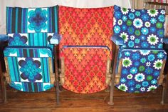 four colorful chairs sitting next to each other