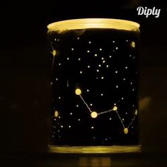 a black glass with yellow dots on it in the dark, lit up at night