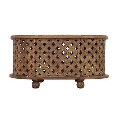 an old wooden planter with holes in it