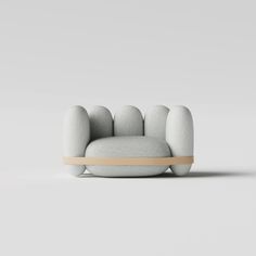 a white couch sitting on top of a wooden frame