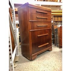 a large wooden dresser sitting on top of a floor