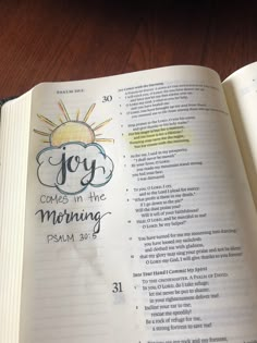 an open bible with the words, joy comes in the morning