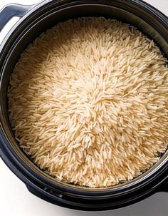 the rice is in the pot ready to be cooked and put into the slow cooker