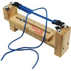 a wooden box with blue cords attached to it