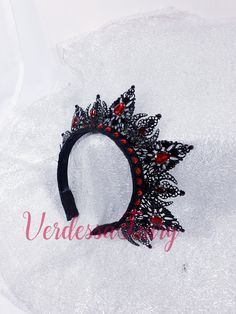 This black tiara crown halo has metal lace filigree mounted to a headband with sparkly Ruby red glass and Swarovski rhinestones. An elegant and beautiful piece that is excellent for so many occasions from dance costumes to dressing up as a queen, photo shoots and special occasions. This beautiful crown is elegant and regal.  A Gothic look halo of black coloured filigree to adorn the top of the head with tear drop and navette glass gems for extra colour and sparkle.  Mounted to a narrow Alice hea Black And Red Crown, Dark Fairy Crown, Red Flower Crown, Gothic Queen, Halloween Crown, Fairy Headpiece, Rose Headpiece, Alice Headband, Halo Headpiece