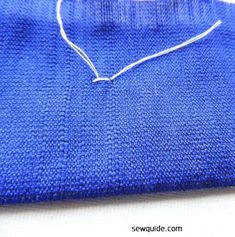 a blue cloth with white thread on it