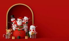 a group of snowmen standing next to each other in front of a red wall