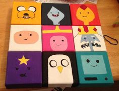 a group of cartoon characters painted on wooden blocks