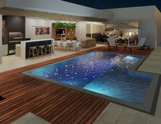 an indoor swimming pool in the middle of a living room and dining area with bar stools