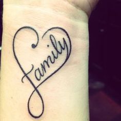 a tattoo on the wrist that says family with a heart in the center and an arrow at the bottom