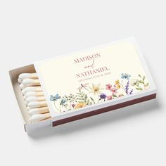 matchesticks in a box with flowers on them