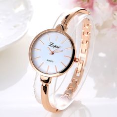 Item Type: Wristwatch Dial Material: Stainless Steel Alloy Dial Window Material: Glass Band Material: Stainless Steel Alloy Dial Diameter: 3.5 cm Dial Thickness: 0.8 cm Band Length: 20.5 cm Band Width: 1.6 cm Water Resistance: Not Waterproof Clasp Type: Bracelet Clasp Shape: Round Weight: 60 g Features: Women's Wristwatches, Metal Band, Luxury Watches, Thin Band, Stylish Wristwatches, Elegant Wristwatches Bracelet Watches Women, Watch Trends, Watch Gift, Womens Watches Luxury, Women Bracelet