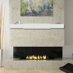 a modern fireplace in a living room with white walls