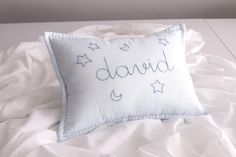 a white pillow with the word david written on it