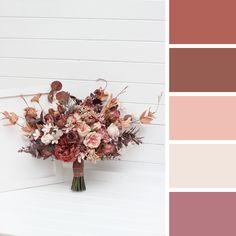 a bouquet of flowers sitting on top of a white bench next to color swatches