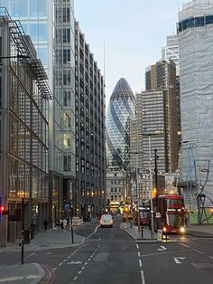 a city street filled with lots of tall buildings