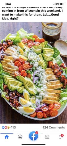 a plate filled with lots of food on top of a wooden table