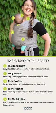 a woman holding a baby in her sling with instructions on how to use the wrap