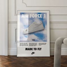 an air force 1 poster hangs on the wall next to a pair of white shoes