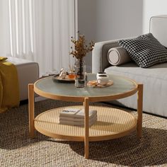 a living room with a couch, coffee table and pillows on the carpeted floor