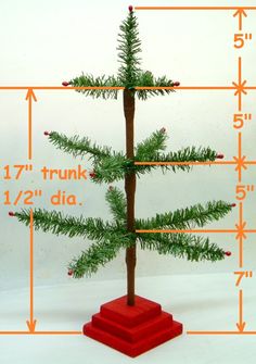 a small christmas tree is shown with measurements