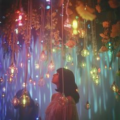 a woman standing in front of a bunch of lights