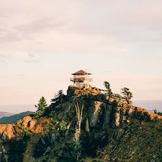 a small tower on top of a mountain