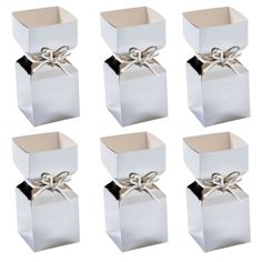 six white boxes with bows tied together