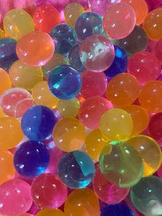 many different colored balls are in a pile