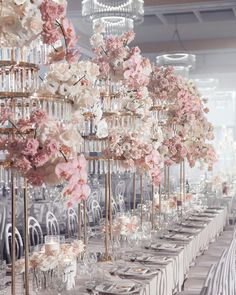 a long table with flowers and candles on it