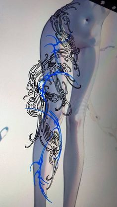 an artistic image of a woman's legs and body with blue lines on them