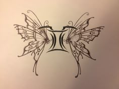 a drawing of a butterfly with wings on it's back and the letter t